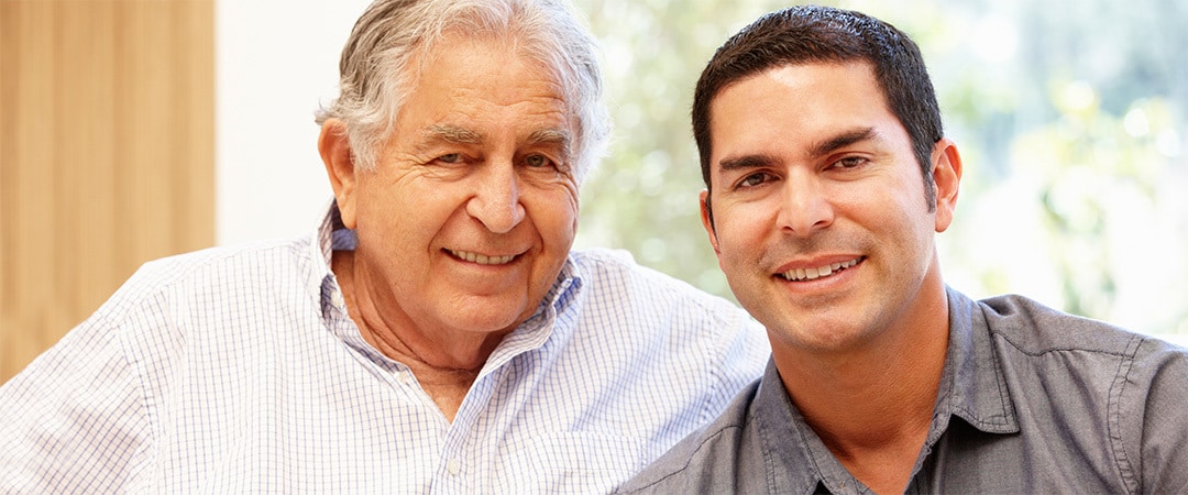 Father and son seating in the waiting room